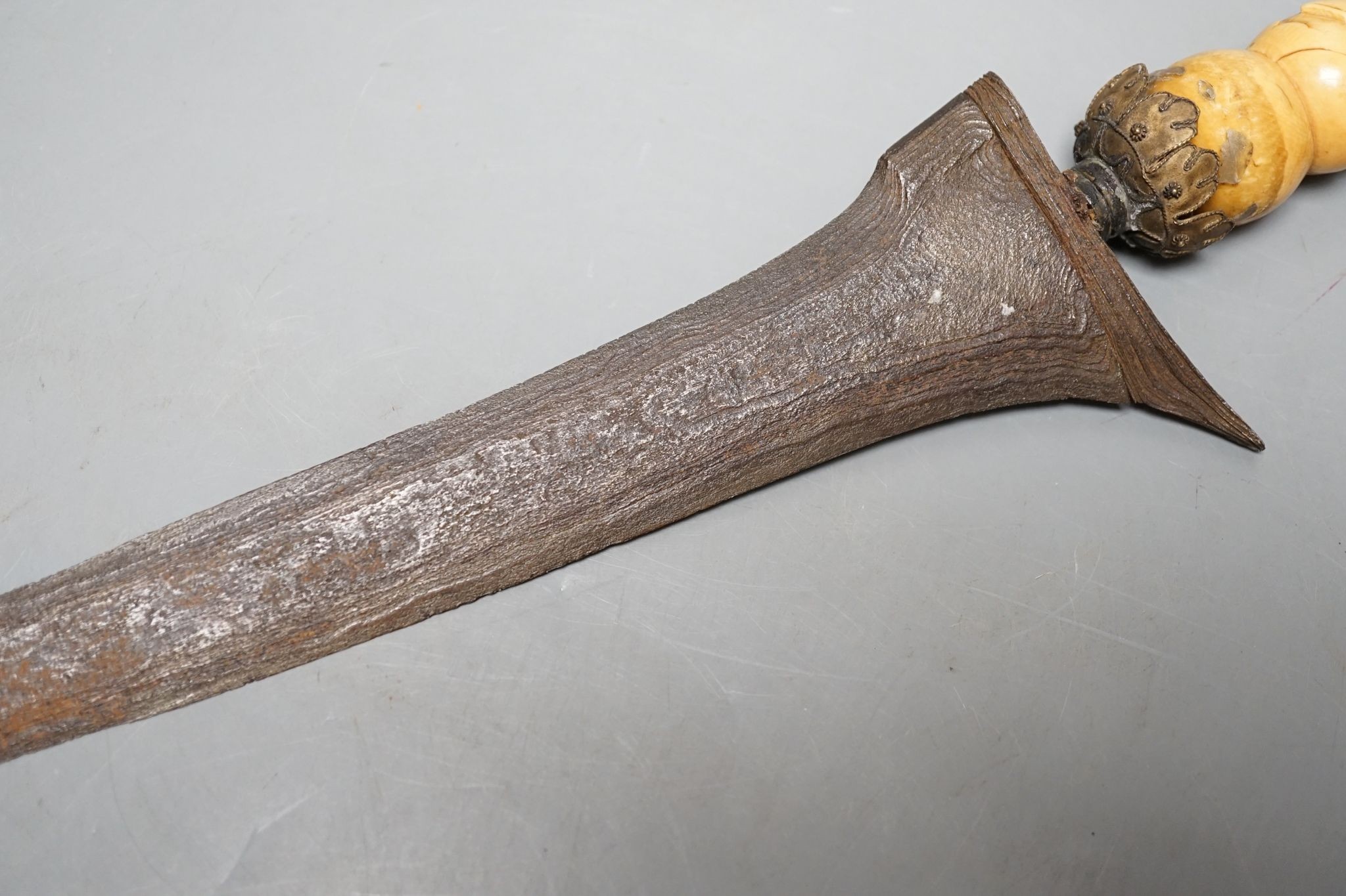 A 19th century ivory handled Kris, 40 cms long.